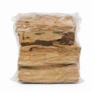 Stack of wooden logs wrapped in clear plastic on a white background