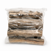 Stack of firewood logs wrapped in clear plastic on a white background