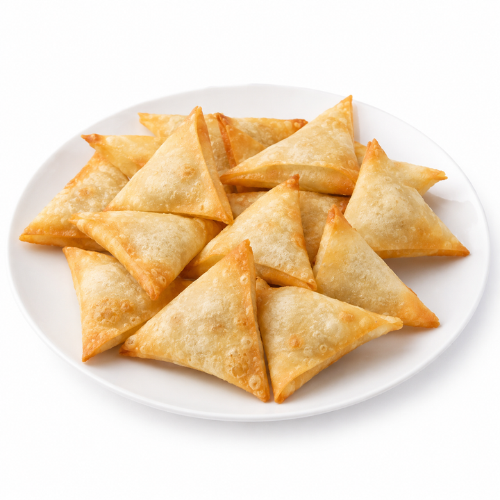 Potato samosas on a white plate