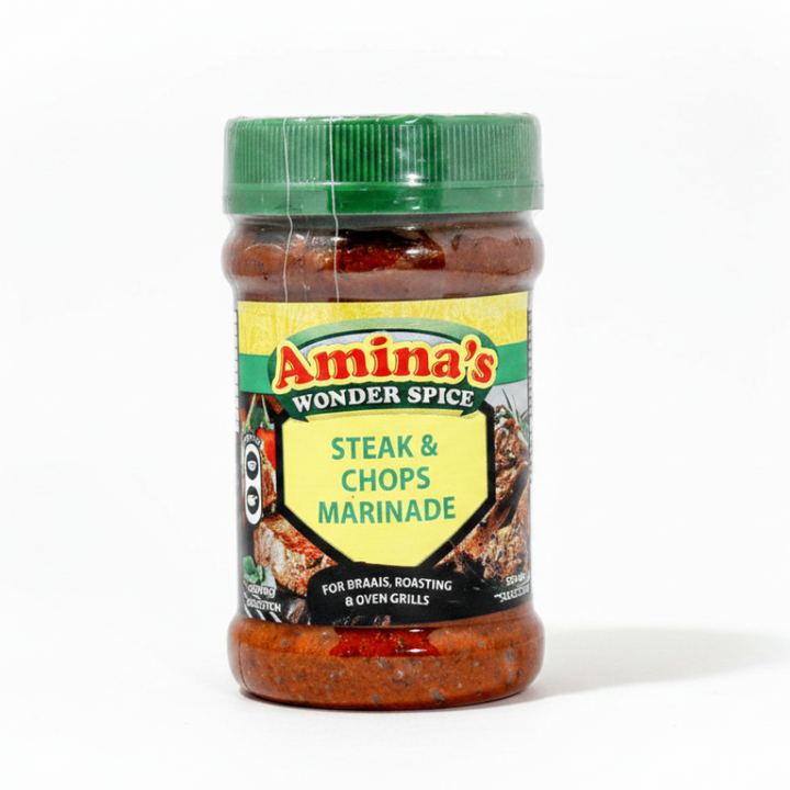 Jar of Amina's Steak & Chops Marinade on a green background