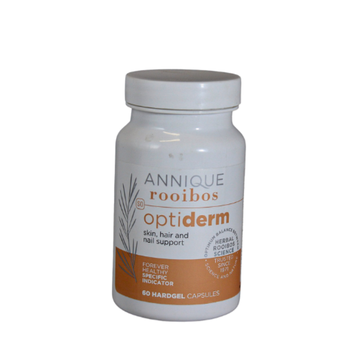 A bottle of Annique OptiDerm skin health supplement capsules.