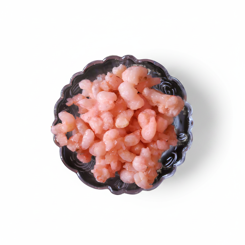 A bowl of cooked shrimps on a white background.